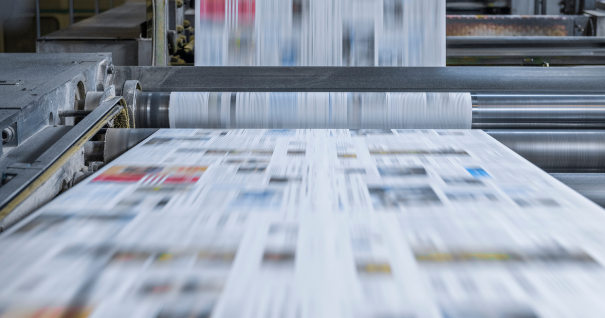 A large color printer in motion